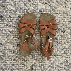 Brown leather salt water sandals. Womens size 7.5. Size 5 in salt waters.